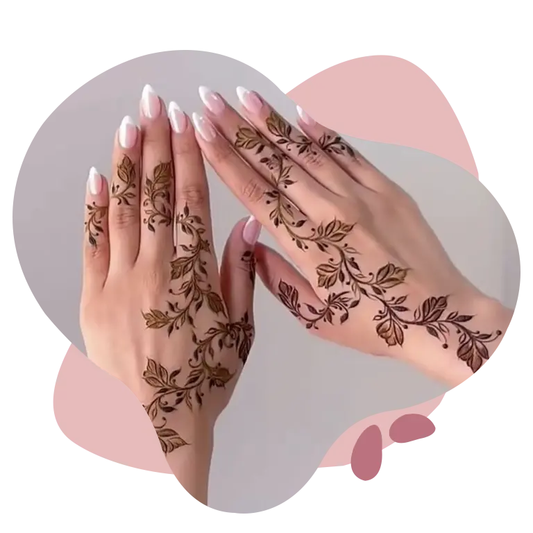 Close-up of beautifully decorated hands with intricate floral henna patterns and soft pink manicured nails.